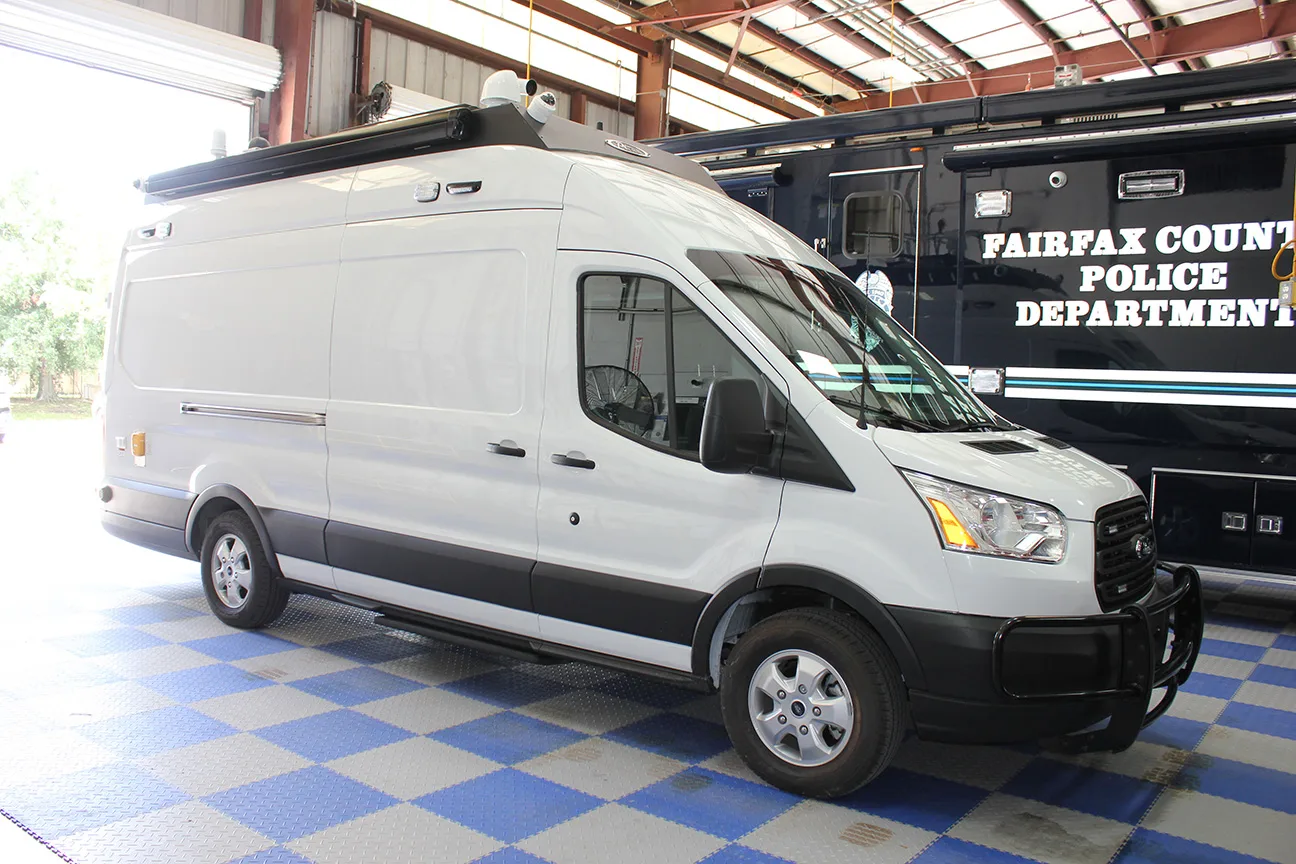 Passenger's side of a CRU-22 Mobile Command vehicle parked inside the Frontline Communications facility.