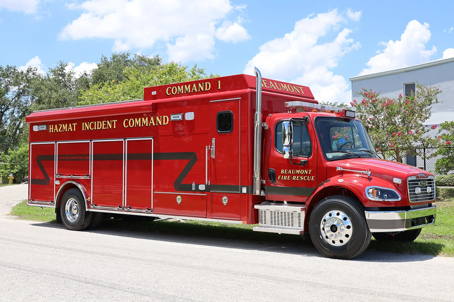 ExxonMobil Hazmat Incident Command Specialty Vehicle parked outside of the Frontline Communications building on a sunny day.