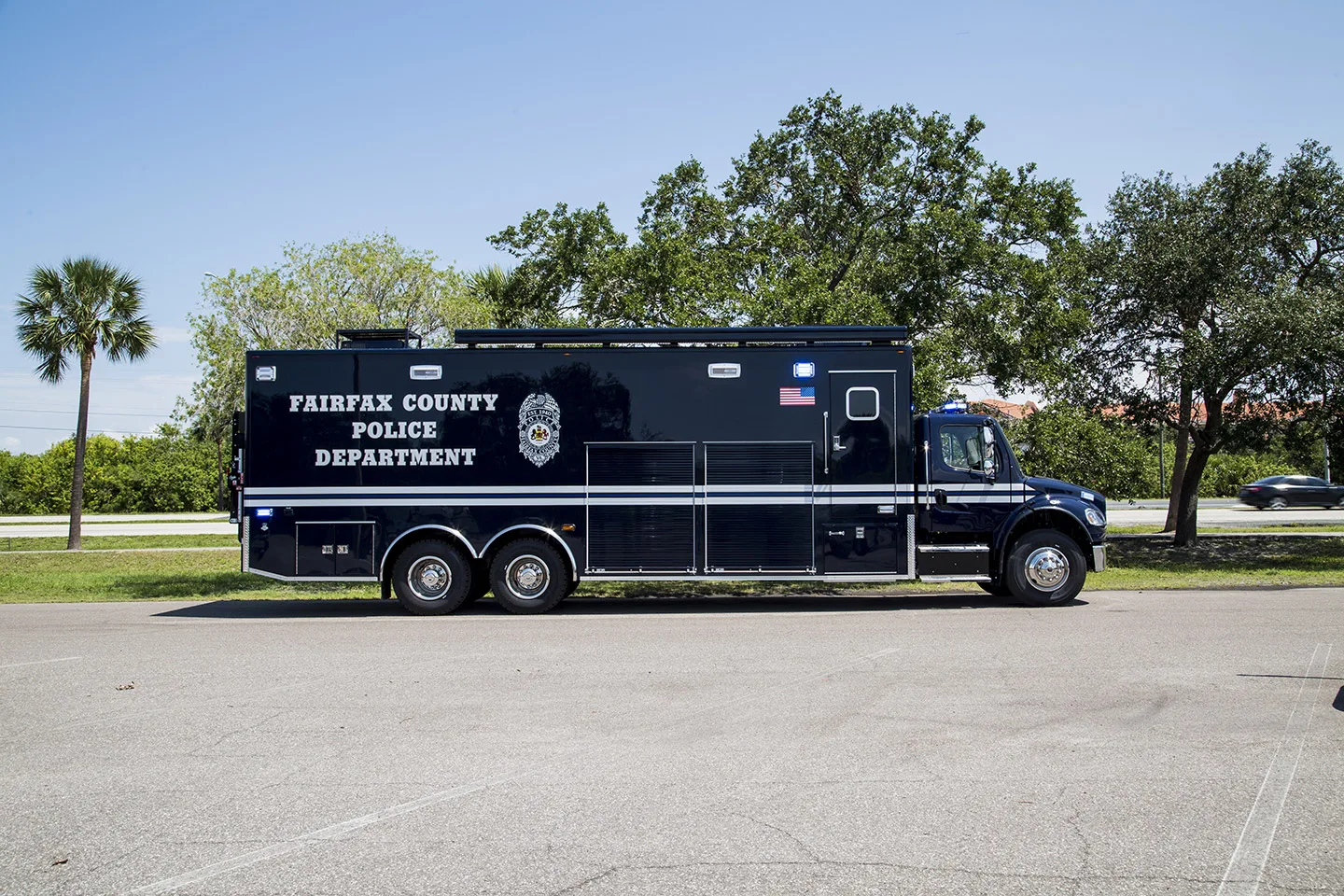 Frontline Communications C-40 SWAT vehicle parked outside on a sunny day.