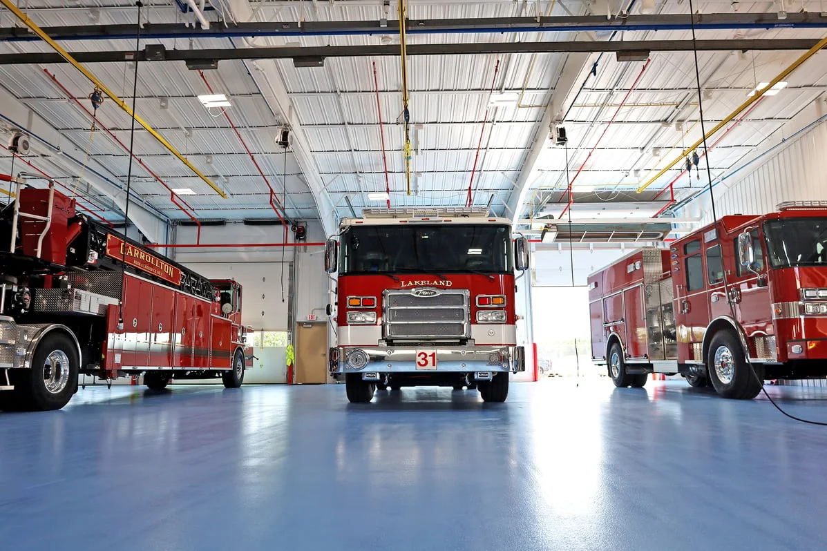 Fire trucks on the Pierce blue floor