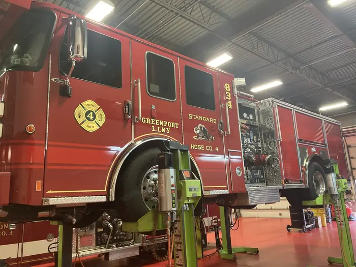Firematic technician performing truck service