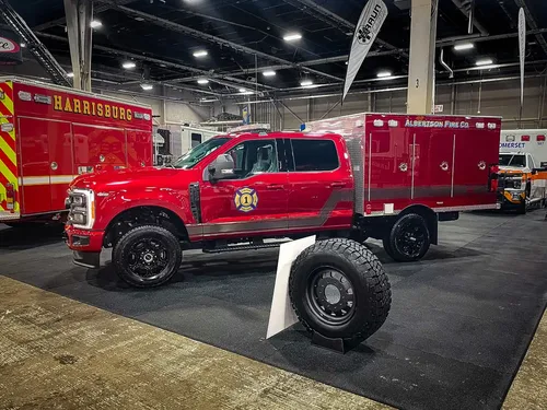 Driver-side profile in garage with enclosed utility body.