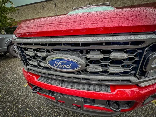 Front grille close-up with Ford emblem and lower light bar.