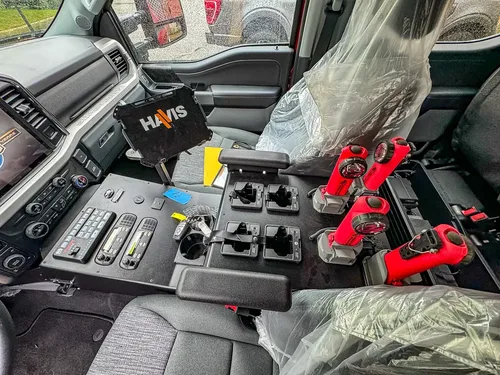 Center console with mounted handheld controls and switches.