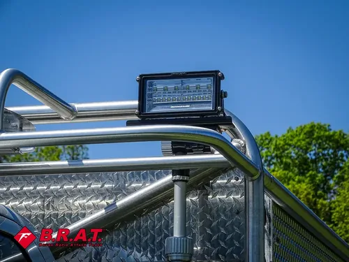 Roof rack top light mounted above side rail.
