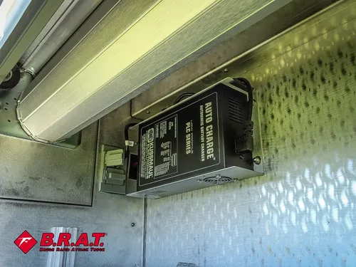 Compartment interior with mounted electrical control panel.