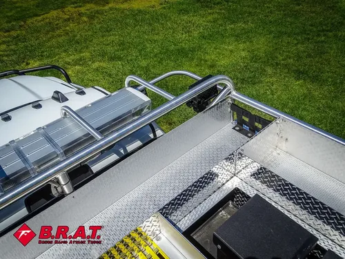 Top rear deck edge with rails and hatch framing.