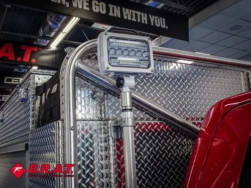 Rear scene light mounted on frame above compartment corner.