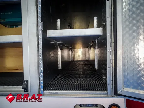 Open vertical storage bay with upper shelf and side rails.