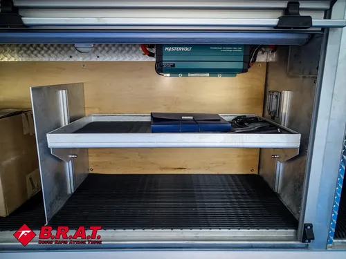 Long horizontal compartment with sliding tray extended.