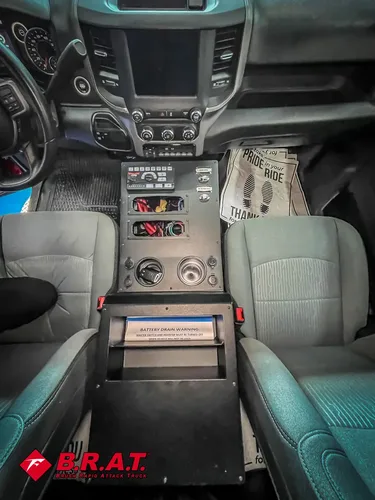 Center console close-up with switches and digital control panel.