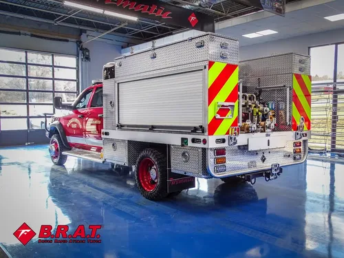 Rear driver-side three-quarter garage view with folded step ladder.