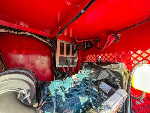 Rear compartment interior with circular vent and mounted equipment boxes.