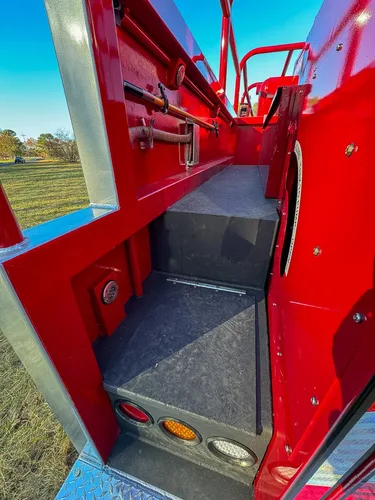Open side storage cubby on upper deck with empty interior.