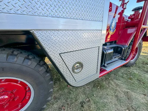 Lower side body panel and front wheel area close-up.