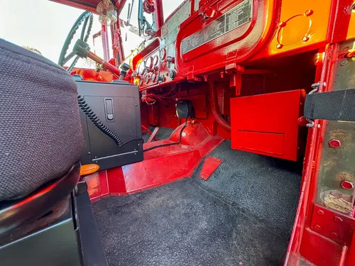 Passenger-side footwell and center tunnel controls close-up.