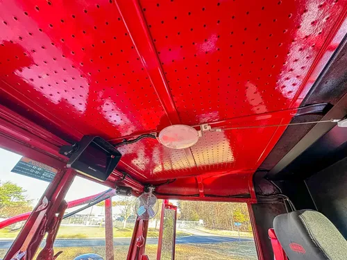 Interior roof panel close-up with mounted dome lights.
