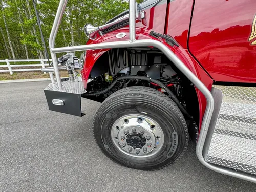 Driver-side profile of red brush apparatus outdoors, photo 212 of 303.