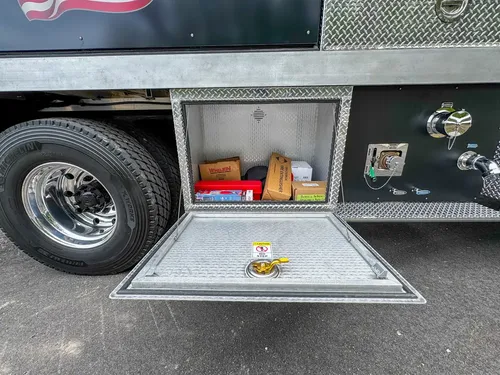 Driver-side profile of red brush apparatus outdoors, photo 242 of 303.
