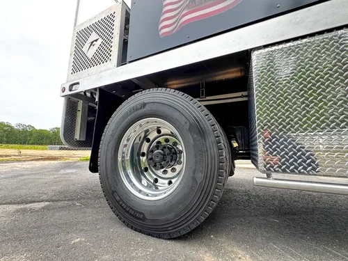 Wheel, tire, and suspension detail on apparatus, photo 268 of 303.