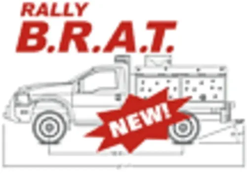 Exterior view of small fire truck showing cab, body compartments, and wheel/tire area.