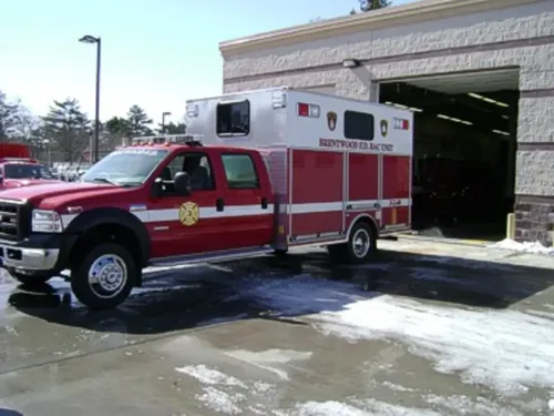 Driver-side profile of rehab unit parked near station bay.