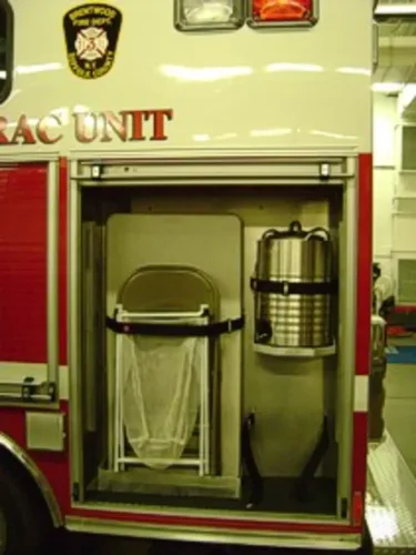 Open side compartment with mounted trash can and beverage container.