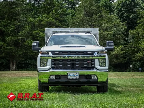 Head-on front view with grille and roof light bar.