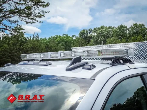 Roof light bar and crossbar mounted above cab.