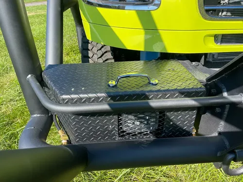 Close-up of textured fold-out step and lower guard tubing.