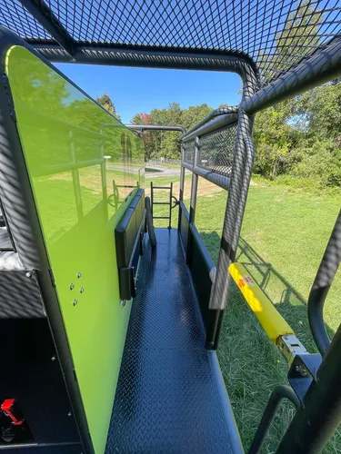 Walkway beside body panel with side shelf and ladder.