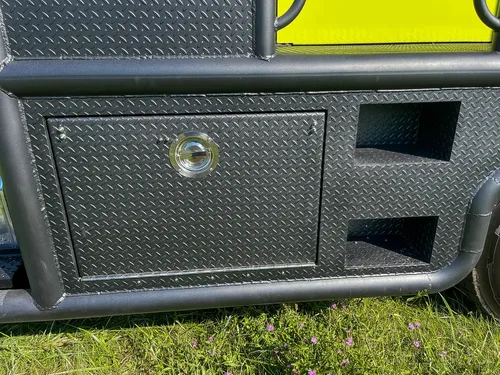 Closed lower side compartments with round latch handles.