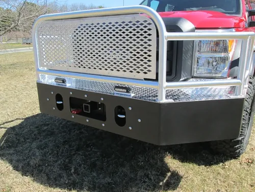 Exterior view of small fire truck showing cab, body compartments, and wheel/tire area.