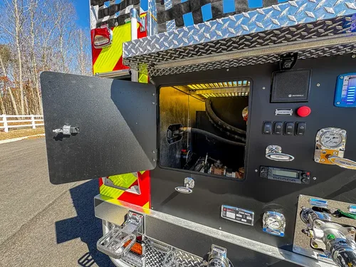 Pump panel with access door open revealing interior control cavity.