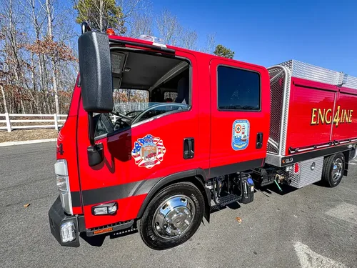 Driver-side cab with door open and steps visible.