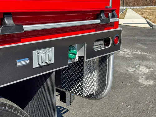 Lower right side body with warning labels and step area.