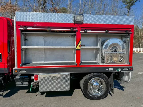 Open long side compartment with shelves and equipment space.