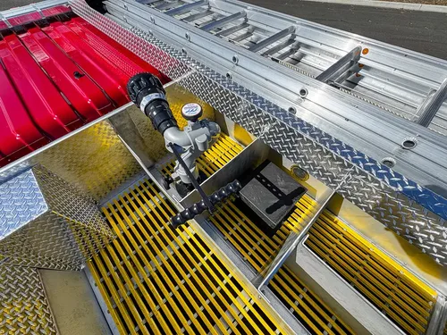 Top-deck close-up with nozzle assembly and deck controls.