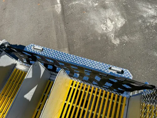 Upper side rail and grating close-up from near the rear.