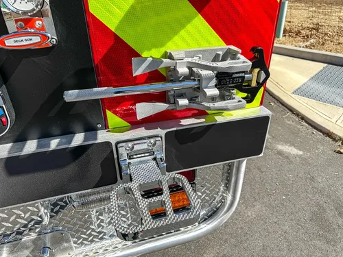 Rear step close-up with mounted hardware and fold-out support.