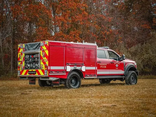Rear three-quarter driver-side view of utility body and cab.
