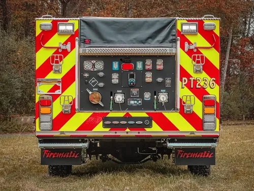 Straight rear view with open pump panel and chevron striping.