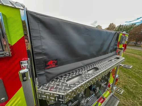 Top rear side walkway with rolled black hose cover.