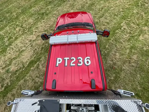 Overhead view of red cab roof from rear deck.