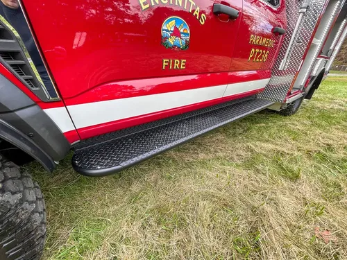 Lower side body with Encinitas Fire crest and step rail.