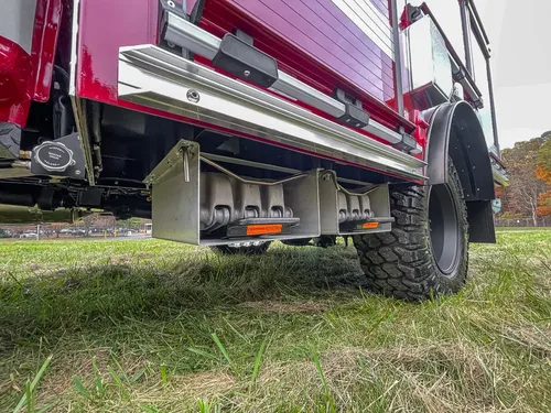Underbody side view showing running board and side storage rack.