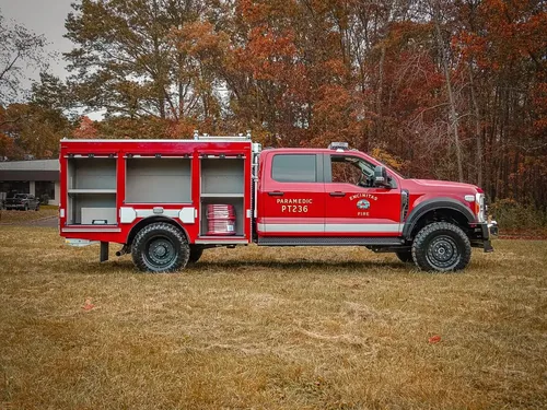 Passenger-side view with multiple compartment doors open.