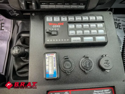 Close-up of lower console with communication keypad and knobs.