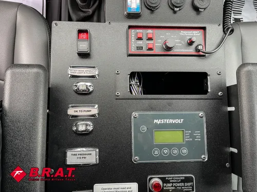 Center switch console with labeled controls and digital display.