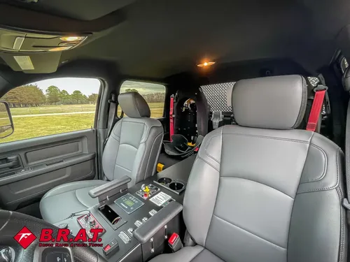 Rear seating area with gray seats and center command console.